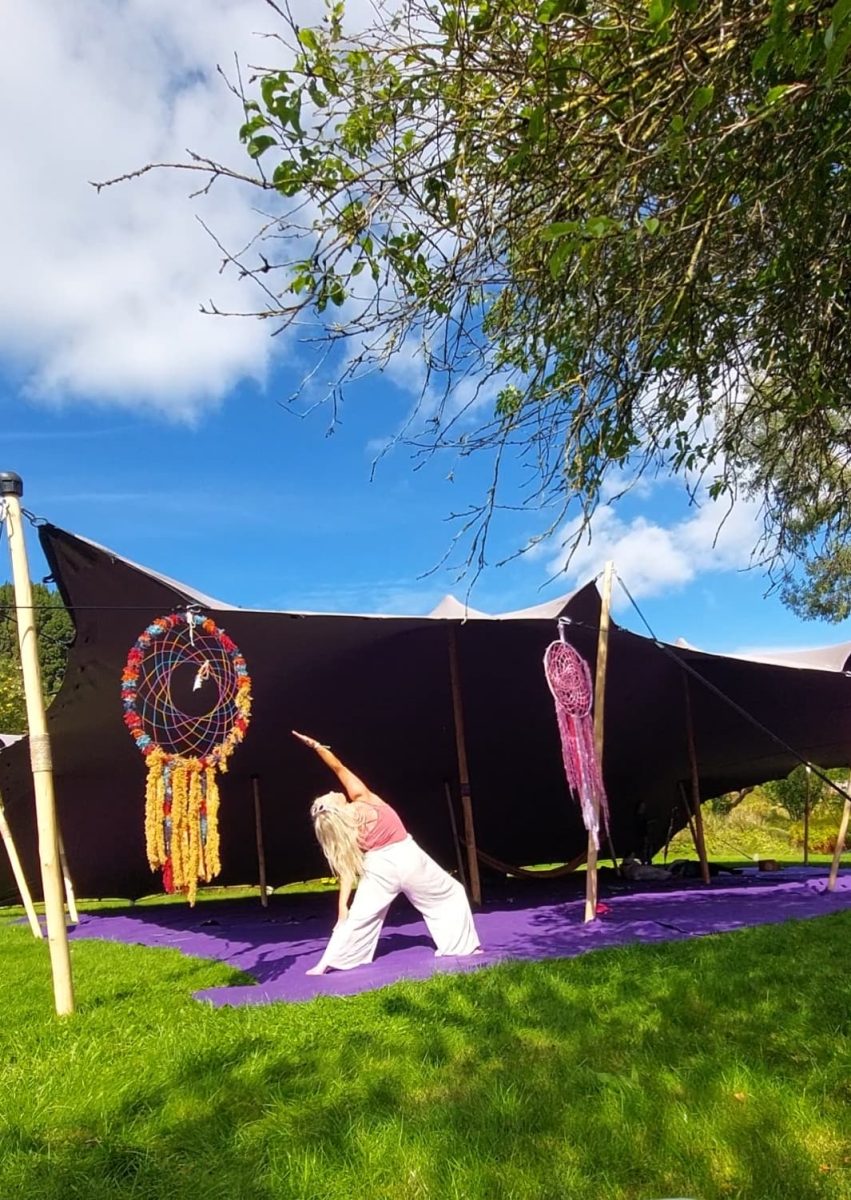 photo of Happy Soul Yoga & Sounds yoga teacher in a yoga pose at music festival 